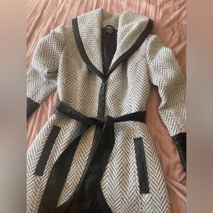 Bebe black and white herringbone patterned coat with faux leather accents.